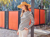 woman in striped shirt and fedora