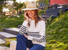 woman in striped sweater and fedora